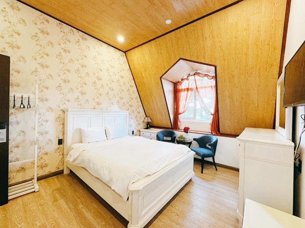 Postel nebo postele na pokoji v ubytování TTR Joy Apart' Hotel