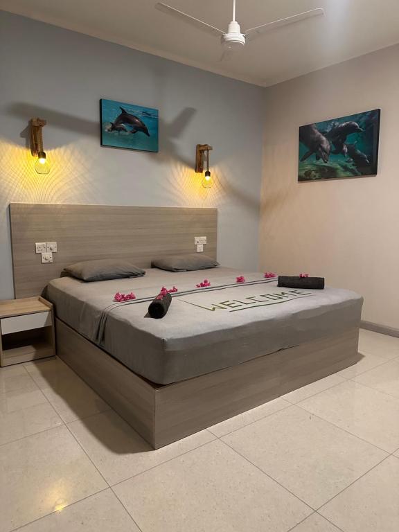 Postel nebo postele na pokoji v ubytování Dive Villa Thoddoo
