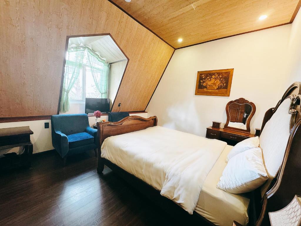 Postel nebo postele na pokoji v ubytování TTR Joy Apart' Hotel