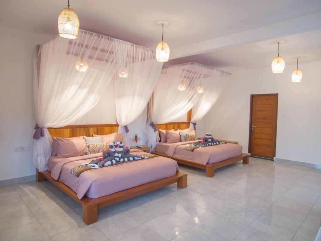 Postel nebo postele na pokoji v ubytování CoCo Breeze Spa Hotel