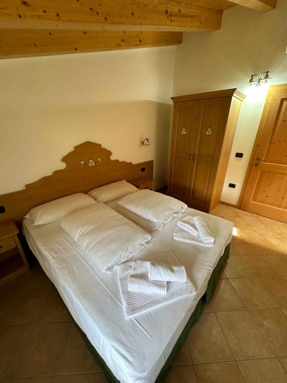 Postel nebo postele na pokoji v ubytování Locanda Castil