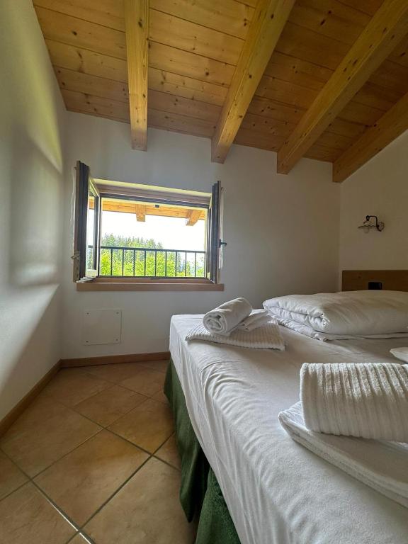 Postel nebo postele na pokoji v ubytování Locanda Castil
