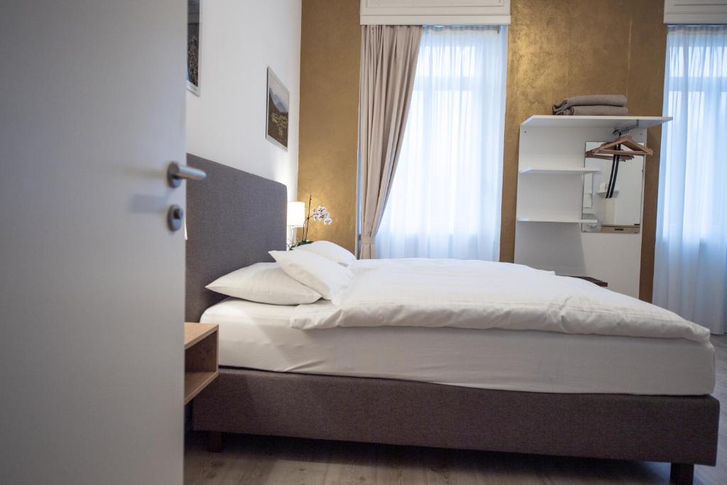 Letto o letti in una camera di Albergo Hotel Tesserete