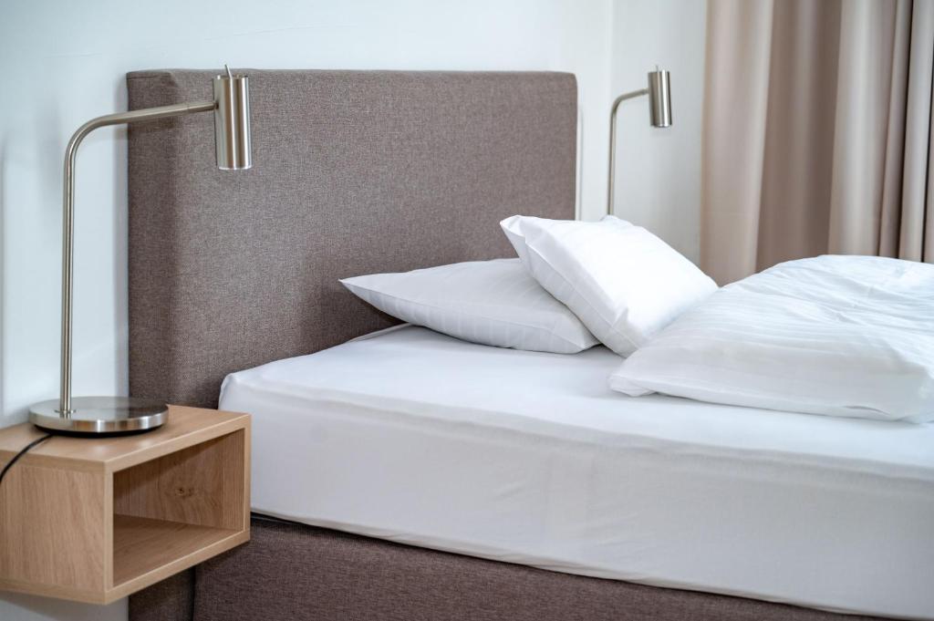Letto o letti in una camera di Albergo Hotel Tesserete