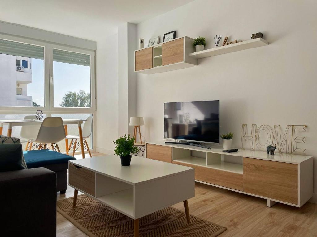 TV a/nebo společenská místnost v ubytování Apartamento Aurora - Ole Solutions