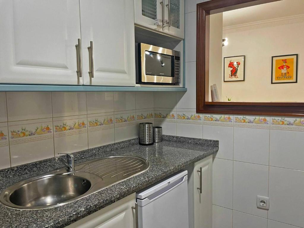 Kuchnia lub aneks kuchenny w obiekcie Apartamento Armas - Ole Solutions