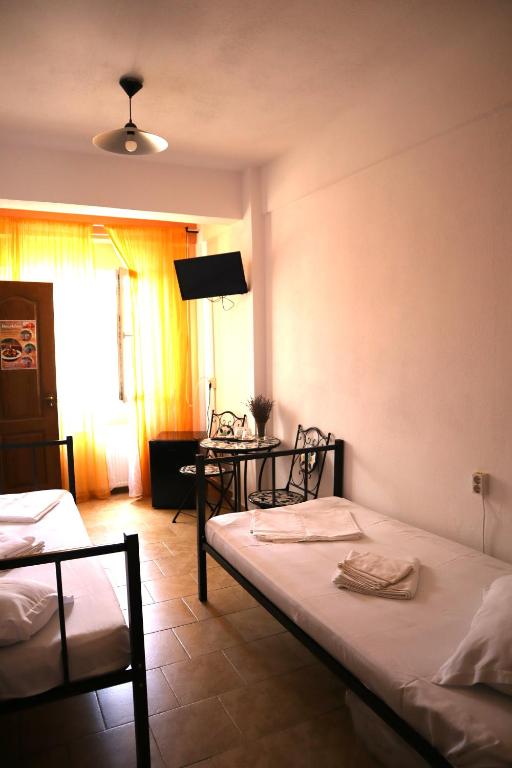 Postel nebo postele na pokoji v ubytování Taxi Hostel