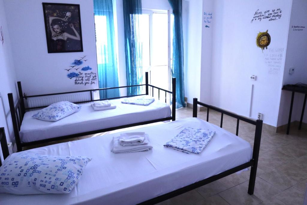 Postel nebo postele na pokoji v ubytování Taxi Hostel