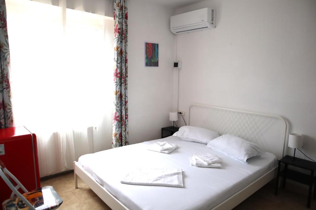 Postel nebo postele na pokoji v ubytování Taxi Hostel