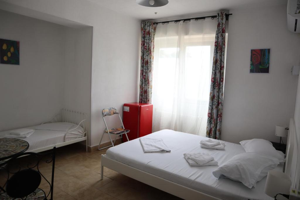 Postel nebo postele na pokoji v ubytování Taxi Hostel