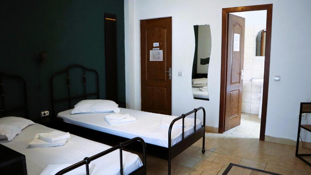 Postel nebo postele na pokoji v ubytování Taxi Hostel