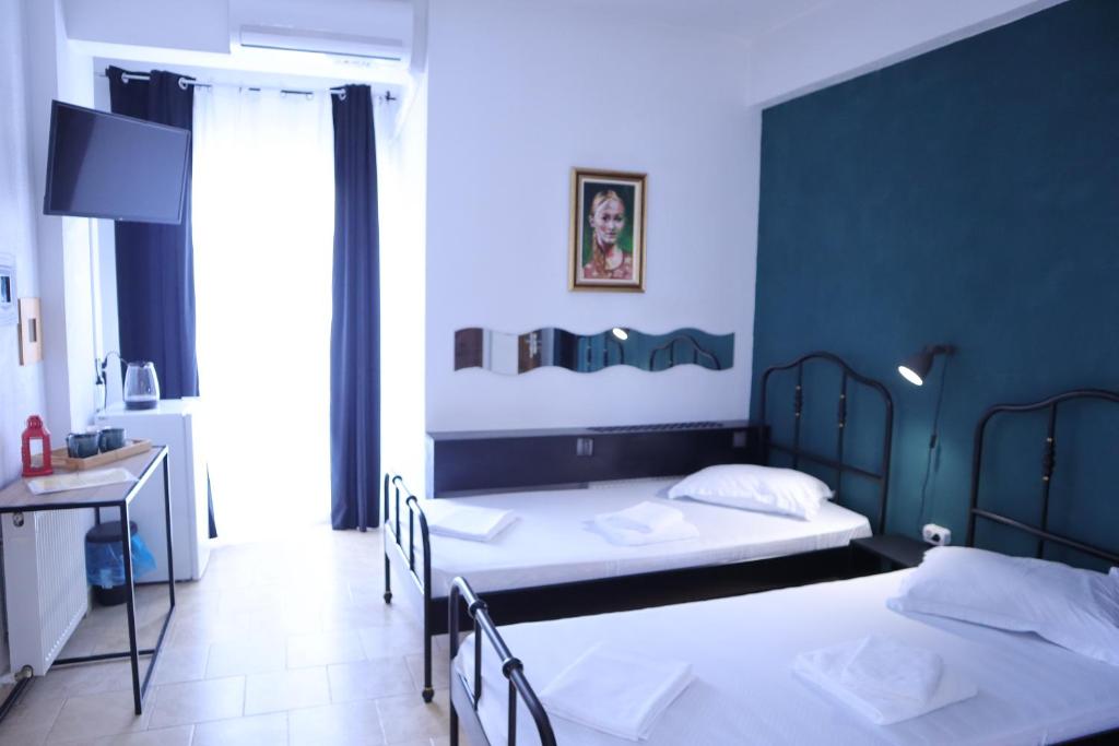 Postel nebo postele na pokoji v ubytování Taxi Hostel