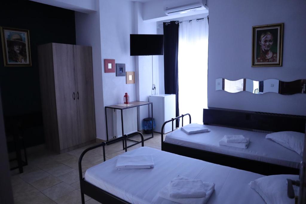 Postel nebo postele na pokoji v ubytování Taxi Hostel