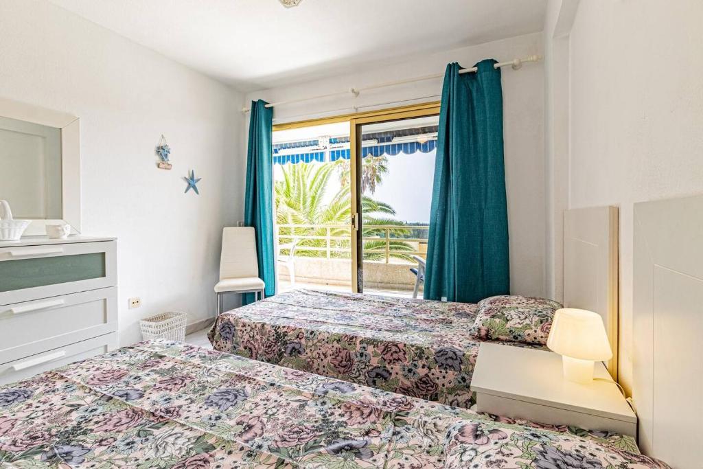 Posteľ alebo postele v izbe v ubytovaní Atlantic Pearl Apt By Dream Homes Tenerife