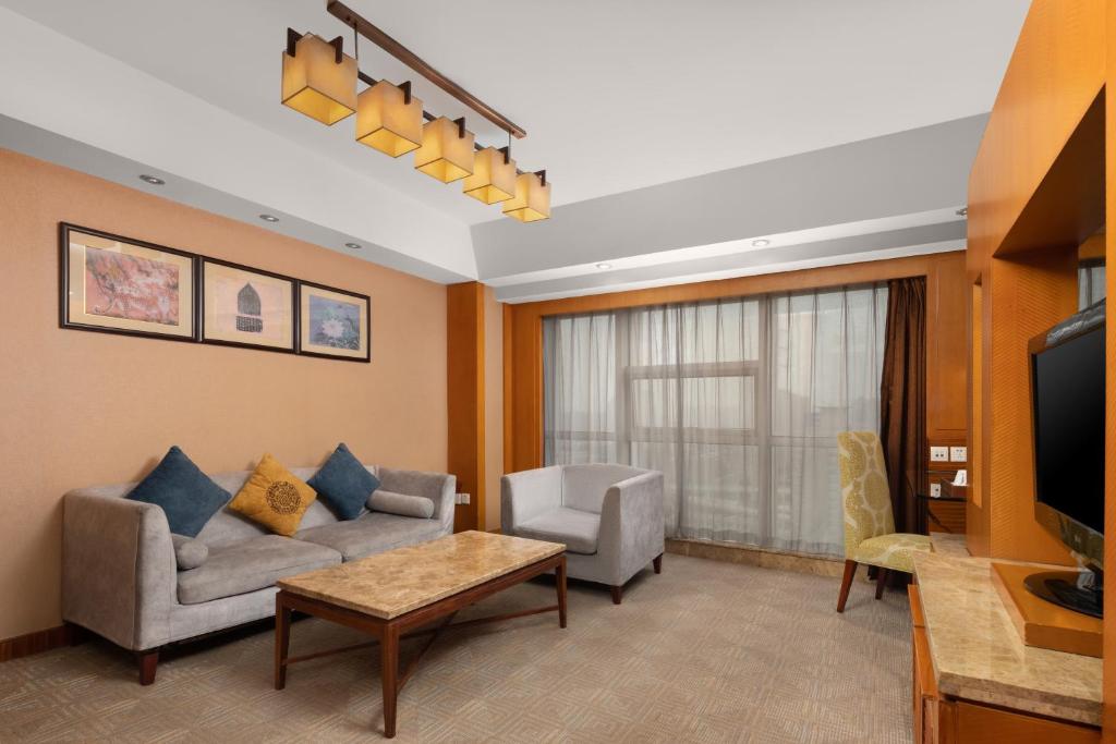 TV a/nebo společenská místnost v ubytování Empark Grand Hotel Xi'an
