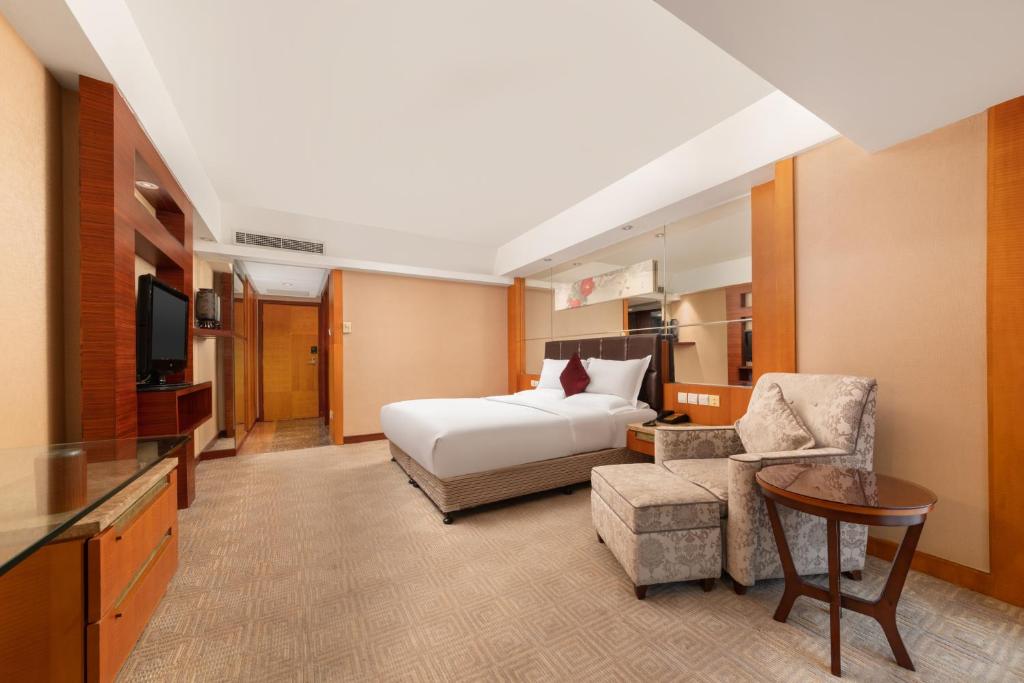 Postel nebo postele na pokoji v ubytování Empark Grand Hotel Xi'an
