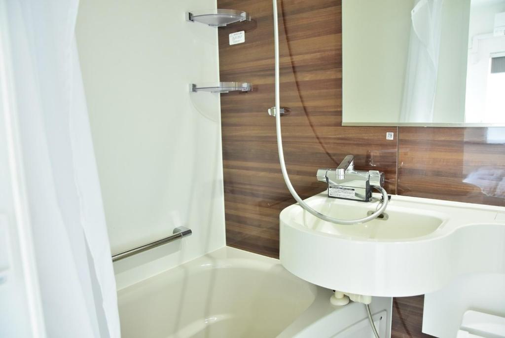 Koupelna v ubytování Hostelコトヒラクラスカ