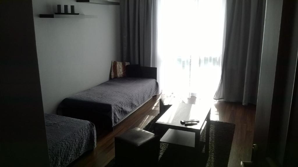 Apartament Sandra tesisinde bir odada yatak veya yataklar