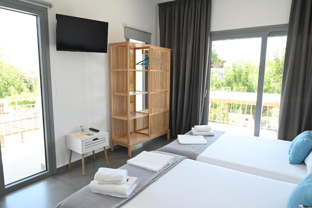 Postel nebo postele na pokoji v ubytování Agorastos Luxury Living