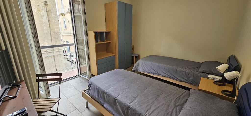 Postel nebo postele na pokoji v ubytování B&B Via Roma