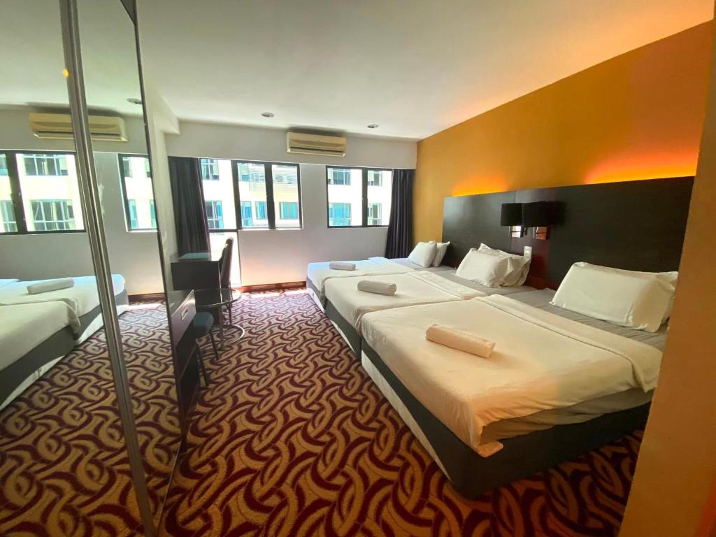 Postel nebo postele na pokoji v ubytování SUN GARDEN Studio and Residences at South China Sea Place Suites