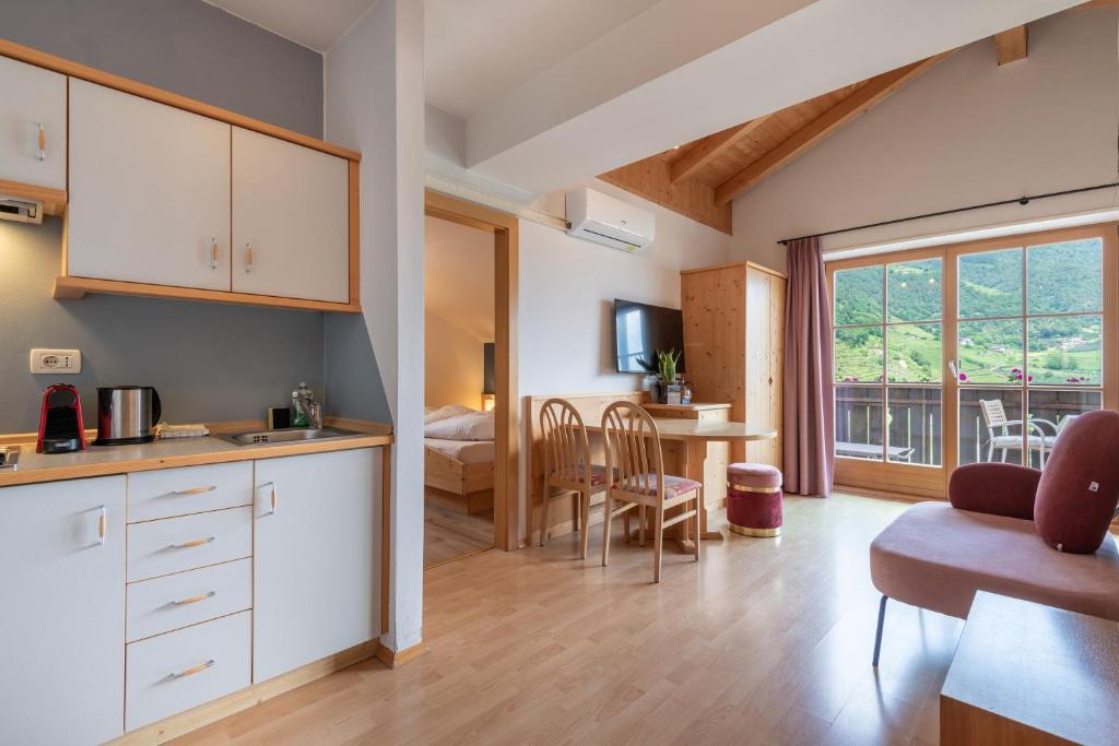 Kuchyň nebo kuchyňský kout v ubytování Hotel Residence MaVie