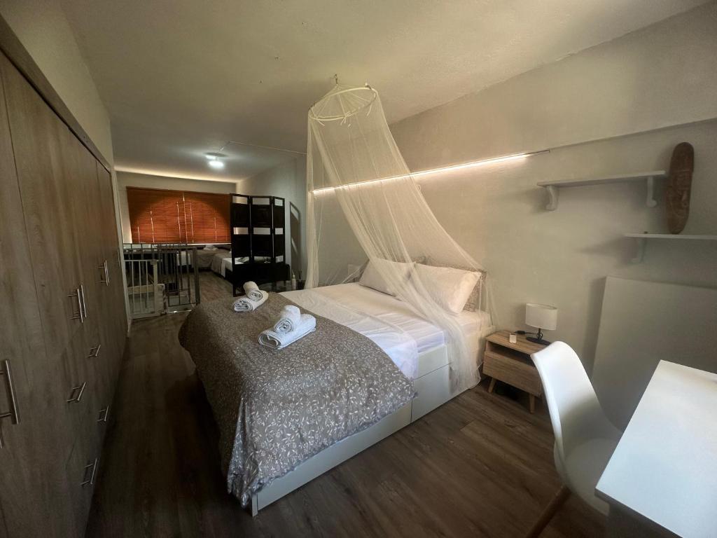 A bed or beds in a room at Melinas Maisonette