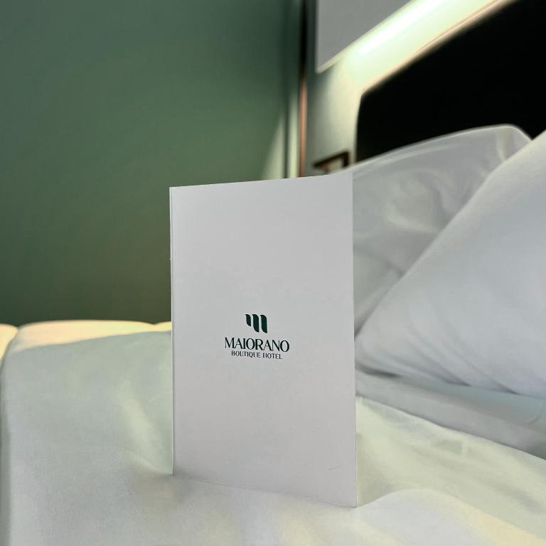 Postel nebo postele na pokoji v ubytování Maiorano Boutique Hotel
