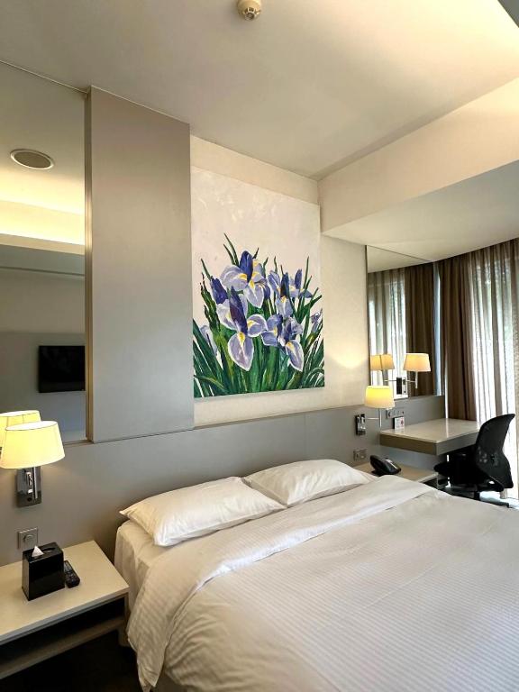 Postel nebo postele na pokoji v ubytování D'Hotel Singapore managed by The Ascott Limited