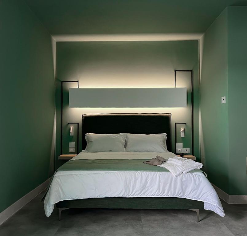 Postel nebo postele na pokoji v ubytování Maiorano Boutique Hotel