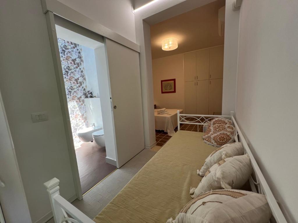 Postel nebo postele na pokoji v ubytování B&B I versi del mare