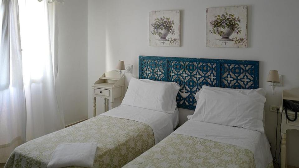 Postel nebo postele na pokoji v ubytování Hotel Lido Garda