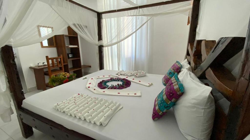 Postel nebo postele na pokoji v ubytování Tropicana Garden