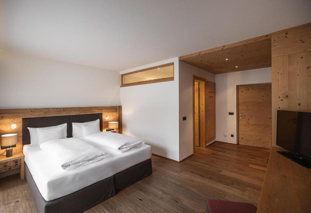 Postel nebo postele na pokoji v ubytování Hotel Alpenblick