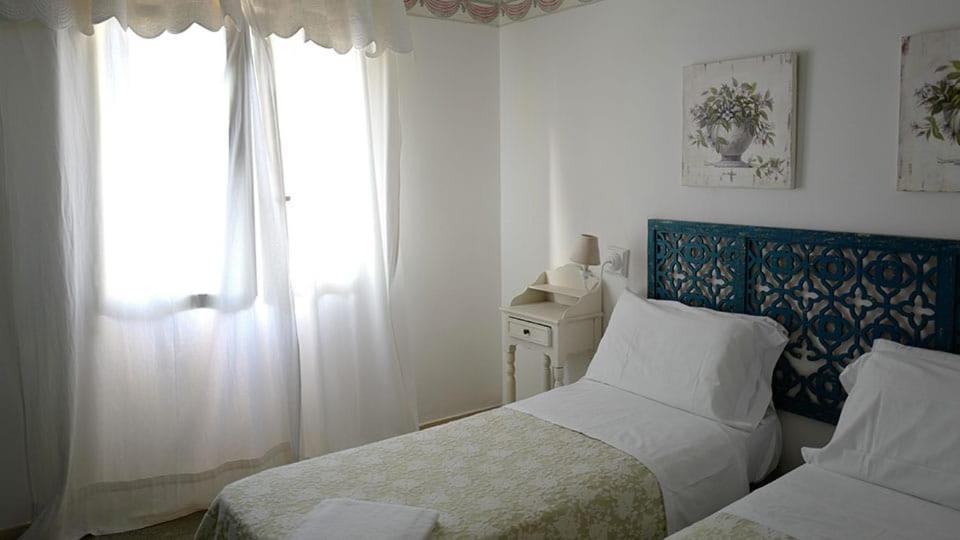 Postel nebo postele na pokoji v ubytování Hotel Lido Garda