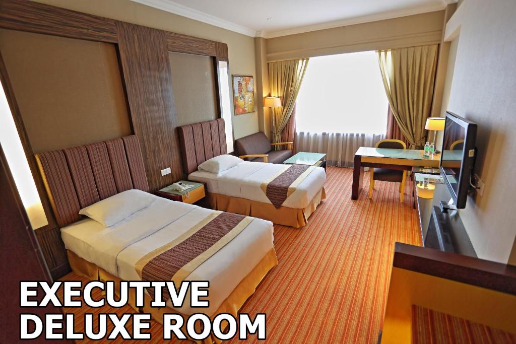 TV a/nebo společenská místnost v ubytování Dynasty Hotel Miri