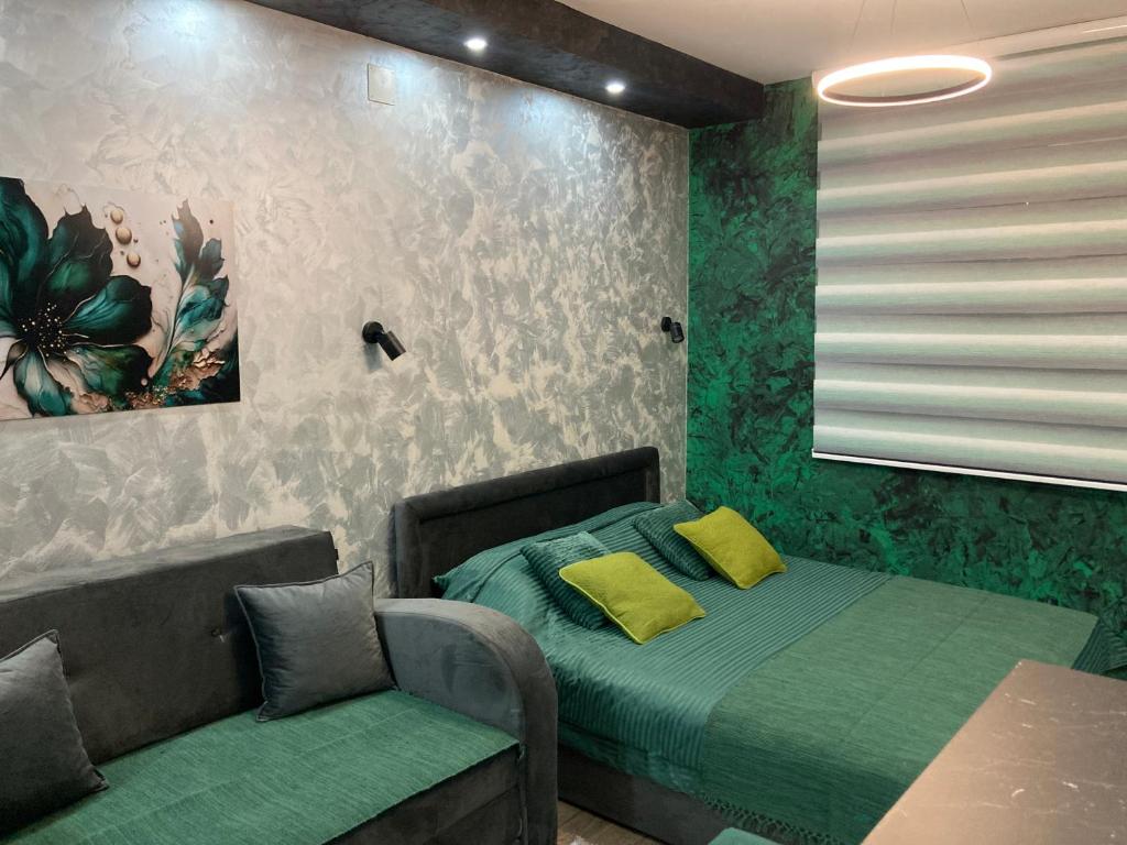Ein Sitzbereich in der Unterkunft Apartman Aleksandar 2