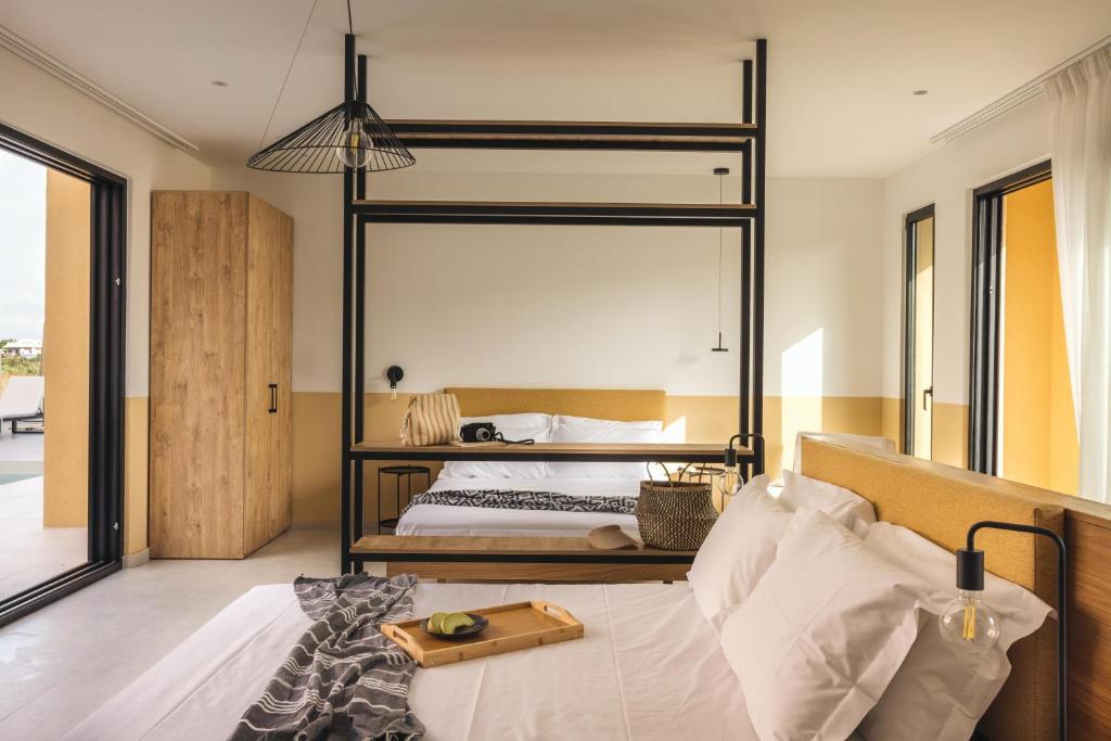 Postel nebo postele na pokoji v ubytování Marea Luxury Suites