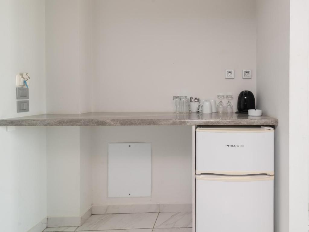 Kuchyň nebo kuchyňský kout v ubytování Callinica Hotel