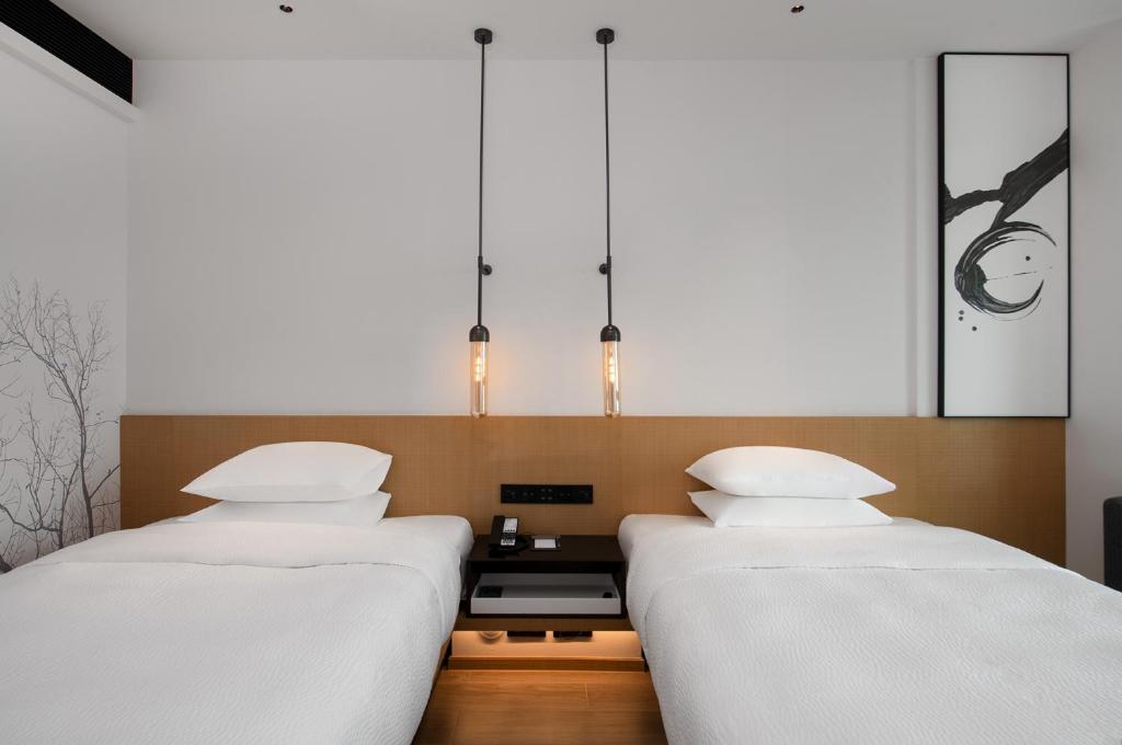 Postel nebo postele na pokoji v ubytování Fairfield by Marriott Shenzhen Bao'an