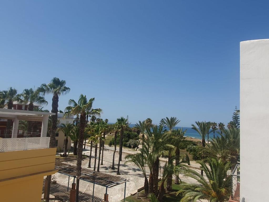 a view of the beach from the balcony of a resort at Bogavante Costa Ballena in Rota