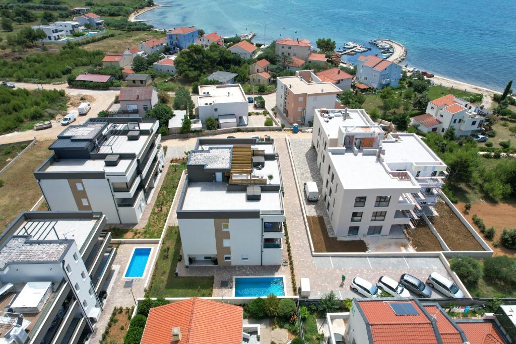an aerial view of a city with houses at Sea&Sand Apartment - Modern Sea View near Sandy Beaches in Privlaka