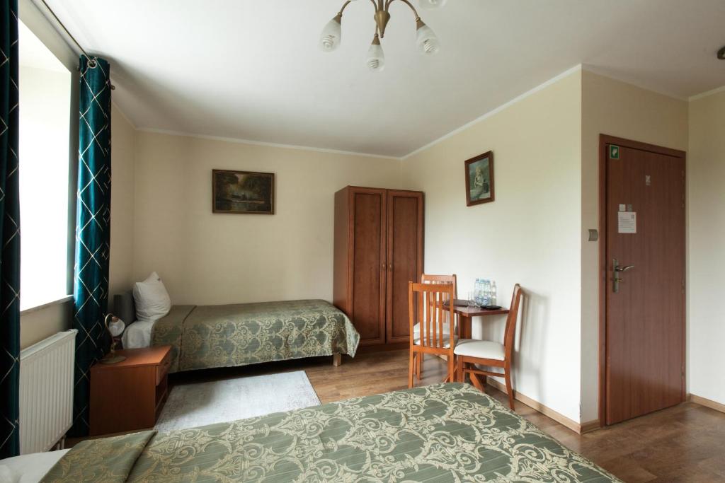 Postel nebo postele na pokoji v ubytování HOTEL I RESTAURACJA BROCHÓW