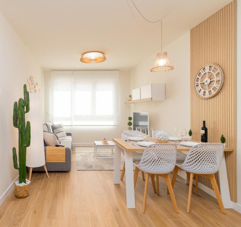 a kitchen and living room with a table and chairs at HOME IN CASTRO con PARKING in Castro-Urdiales