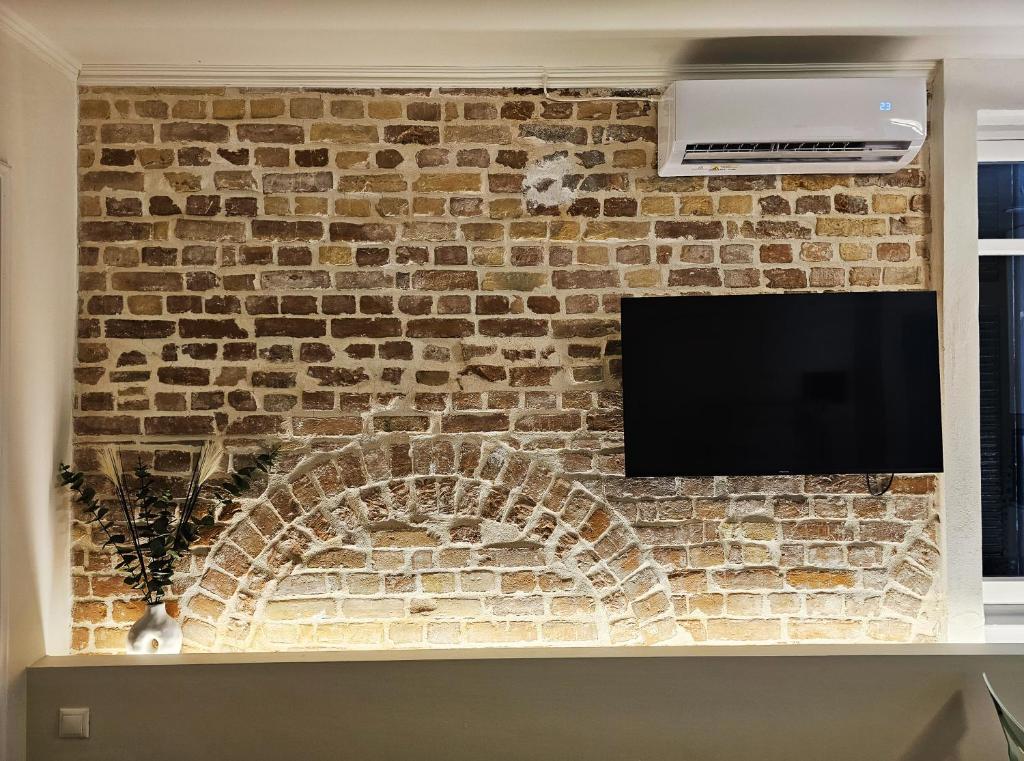 TV a/nebo společenská místnost v ubytování Magnolia Urban Apartment, Corfu Town