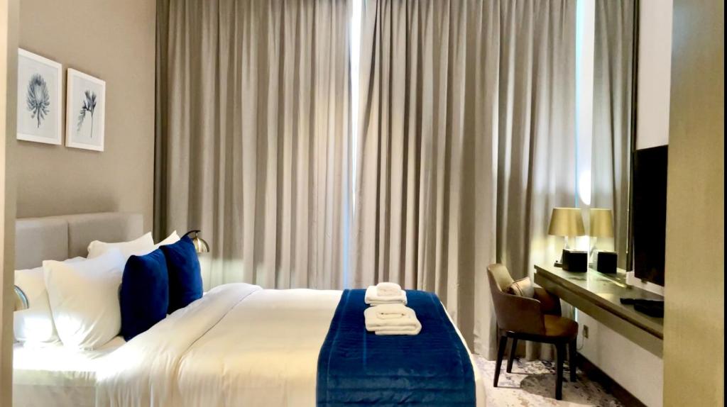 Postel nebo postele na pokoji v ubytování Vacay Lettings - Damac Prive studio