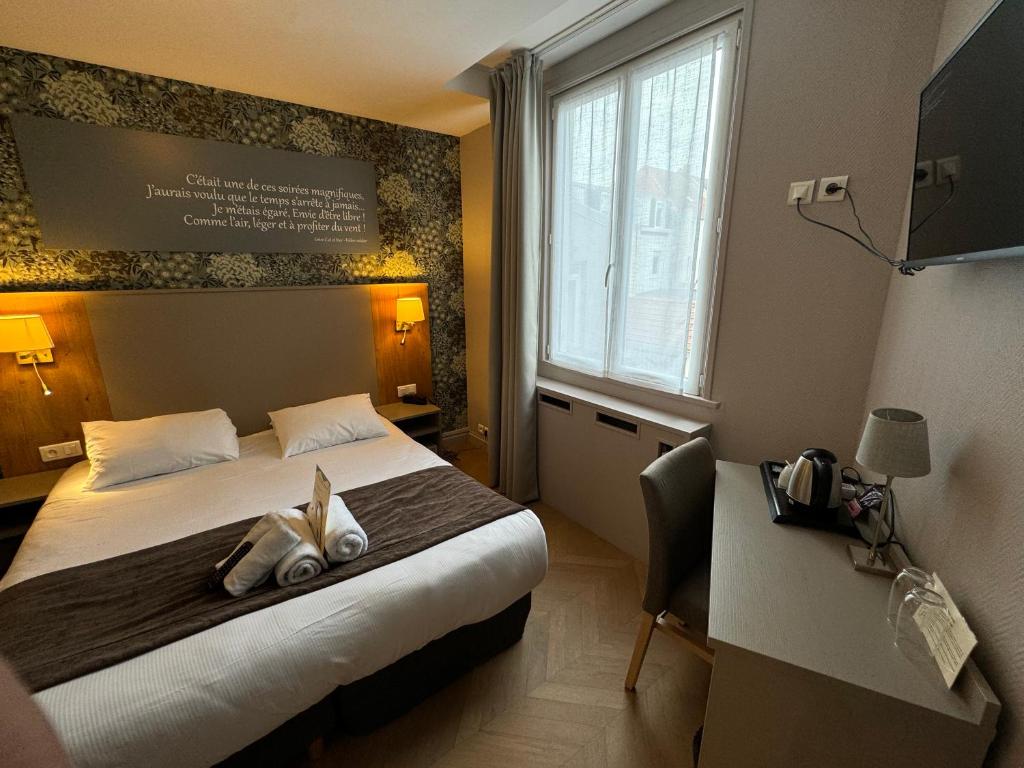Postel nebo postele na pokoji v ubytování Hôtel Villa Des 2 Caps