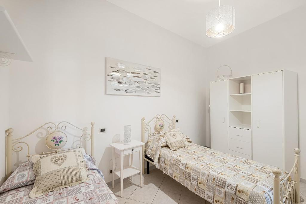 Postel nebo postele na pokoji v ubytování Casa Fuori di Mare