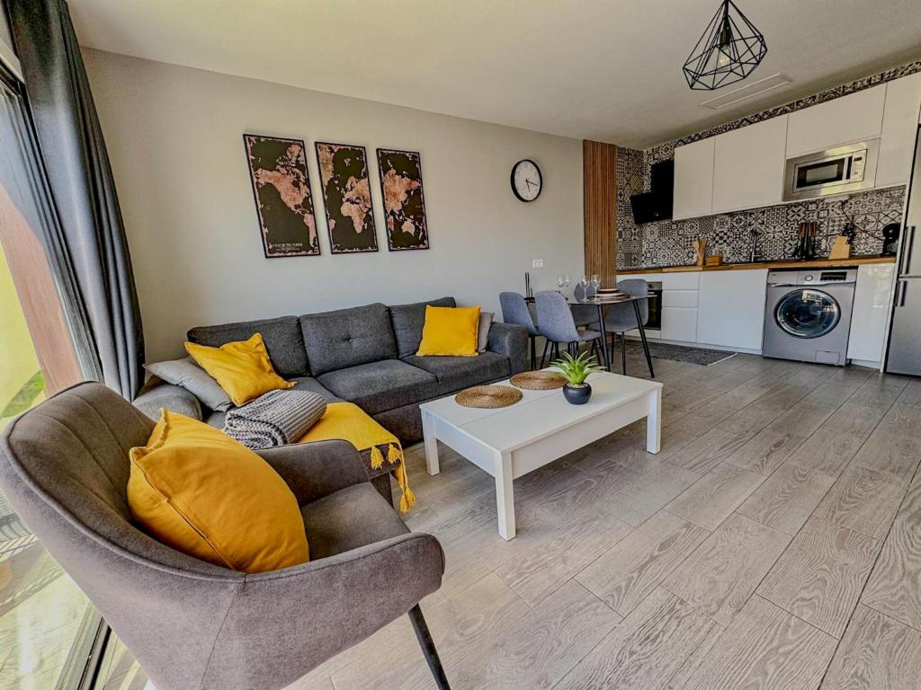 a living room with a couch and a table at Mandarina 326 in San Miguel de Abona