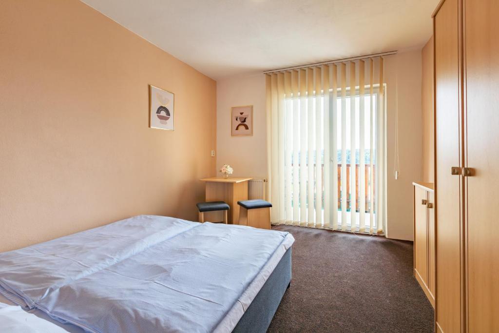 Postel nebo postele na pokoji v ubytování Hotel Sobol